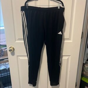 Adidas Black and White Sweatpants with Three-Stripe Design